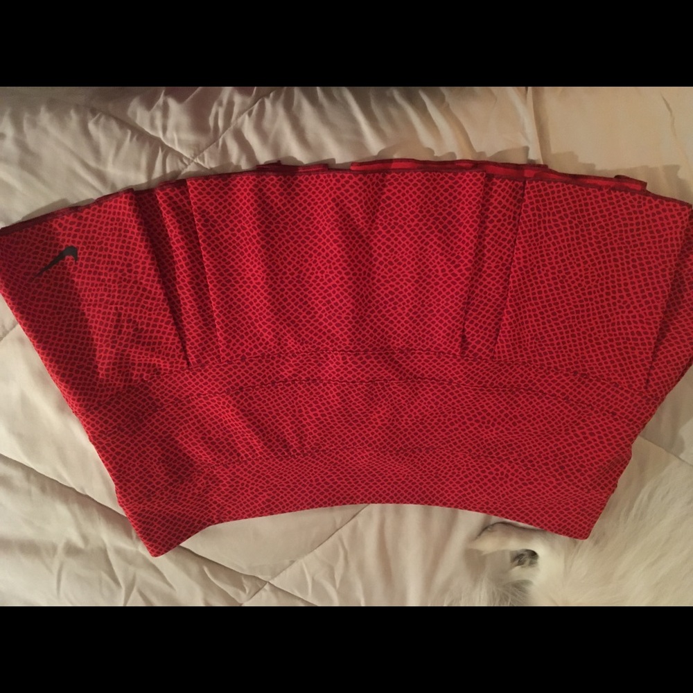 Red Nike pleated tennis skirt.